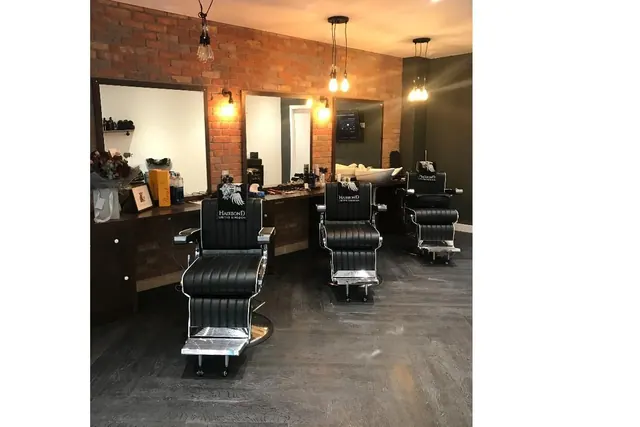 Inside Hansons Barbershop: the chairs, brick walls and pendant lights